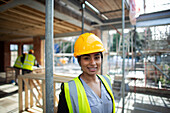 Confident forewoman at construction site