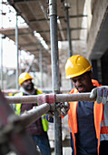 Construction site assembling scaffolding