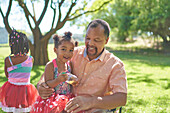 Granddaughter with grandfather in park