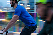 Men riding bicycles