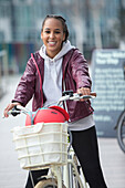 Happy teen girl riding bicycle