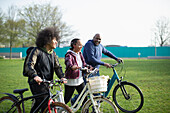 Family with bicycles in park