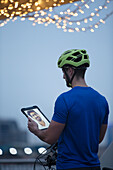 Man in bike helmet video chatting with friend