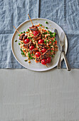 Spiced lamb kebabs with pea and herb couscous