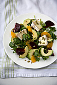 Avocado and beetroot salad with oranges and brie