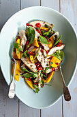 Chicken salad with mango, spinach and chilli