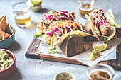 Fish taco with avocado and red cabbage