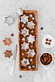 Cocoa tart with orange marmalade and shortbread stars