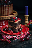 Vegan chocolate cake with fresh summer fruits