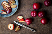 Plums, partially sliced