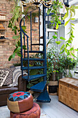 Spiral staircase with hanging plants in the retro-style living room