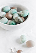 Marbled colored Easter eggs in turquoise, brown, and bronze