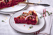 Vegan beetroot tart with thyme and red onions