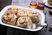 Vegan yeast buns with apple-walnut filling and icing