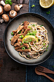 Wholemeal spaghetti in mushroom-cashew 'cream' with fried soy fillet