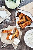 Vegan kohlrabi fries with soy-herb cream