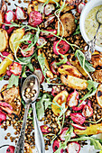 Vegan roasted radishes with crispy lentils and potatoes