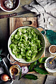 Colander with Brussels sprout leaves