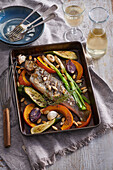 Baked trout with vegetables and pumpkin