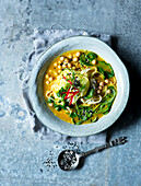 Asian noodle soup with chickpeas and spinach