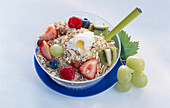 Muesli with fresh fruit in a bowl