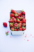 Fresh strawberries in a paper punnet