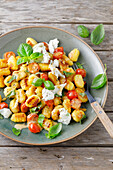 Gnocchi pan with tomatoes and basil