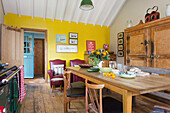 Dining area with country-style table and wooden furniture