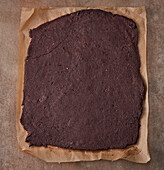 Chocolate sponge cake on baking paper