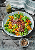 Grilled tequila duck breast with grilled nectarine salad