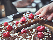 Sweet pizza with chocolate and raspberries