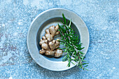 Ginger and rosemary on a plate