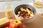 Granola with pieces of cut up apple