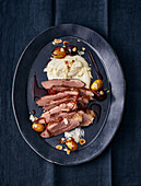 Sous-vide cooked duck breast with curried grapes and cauliflower puree