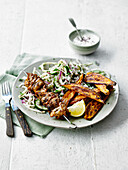 Chicken skewers with cabbage and cucumber salad
