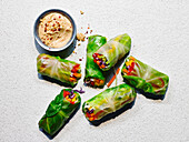 Rainbow cabbage wraps with a dip