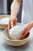 Knead bread dough for farmhouse bread and place in cooking baskets
