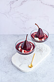 Poached Pears with spiced red wine reduction and vanilla bean yogurt