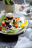 Romantic Spring vegetable salad with flowers