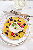 Berry pancakes with ricotta cream, mint, and cinnamon