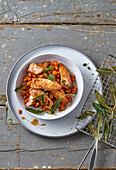 Spicy salmon fillet strips with soy carrots and fried sage leaves