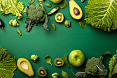 Green fruit and vegetables on green background