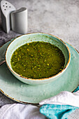 Healthy spinach creamy soup served in a bowl
