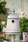 DIY bird nesting box made from a wooden bucket