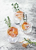 Gin and tonic with blood orange and thyme
