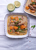 Vegan sweet potato and coconut curry with soy meat and green beans