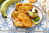 Plantain tostones, fried in canola oil with flaky salt on top