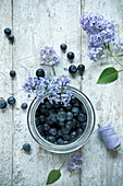 Blueberries in jar on wooden table