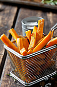 Sweet potato fries with rosmary in chip basket
