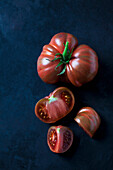 Whole and sliced beef tomatoes 'Chocolate Stripes'